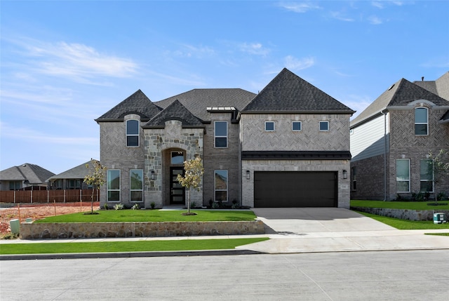 5241 Great Hollow Trl, Fort Worth, TX 76179 - french country inspired facade with concrete driveway, an attached garage, a shingled roof, and brick siding