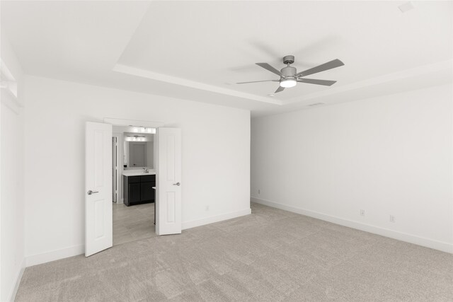 5241 Great Hollow Trl, Fort Worth, TX 76179 - spare room with light colored carpet, a tray ceiling, ceiling fan, and baseboards