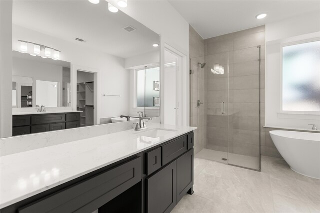5241 Great Hollow Trl, Fort Worth, TX 76179 - bathroom with a shower stall, a freestanding tub, vanity, a walk in closet, and recessed lighting