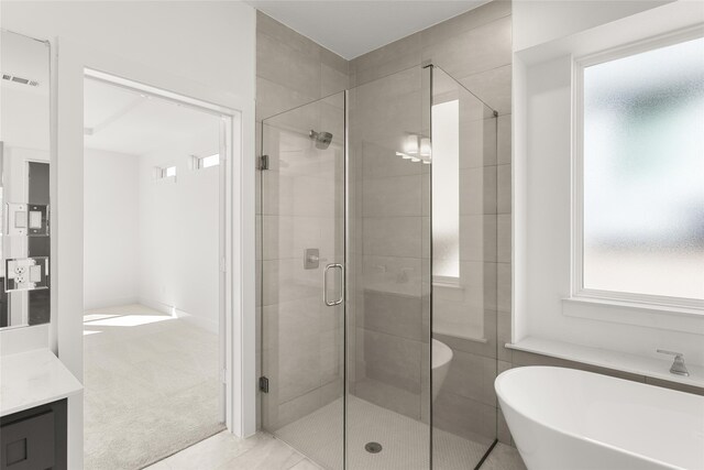5241 Great Hollow Trl, Fort Worth, TX 76179 - bathroom with a stall shower, vanity, a soaking tub, and tile patterned flooring