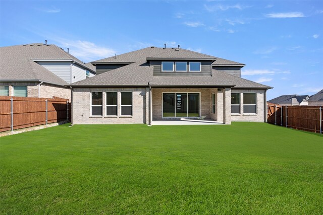 5241 Great Hollow Trl, Fort Worth, TX 76179 - rear view of house with a shingled roof, brick siding, and a patio
