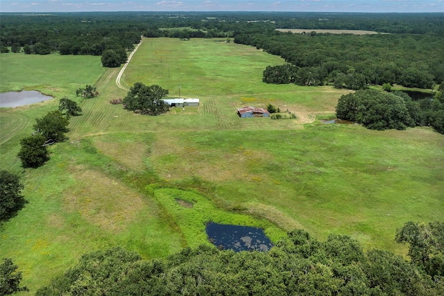 birds eye view of property featuring a rural view and a water view