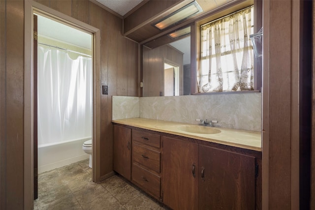 full bathroom featuring toilet, tile floors, shower / bath combination with curtain, large vanity, and a textured ceiling