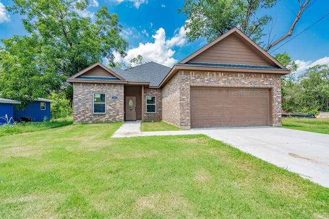 view of front facade with a front yard and a garage