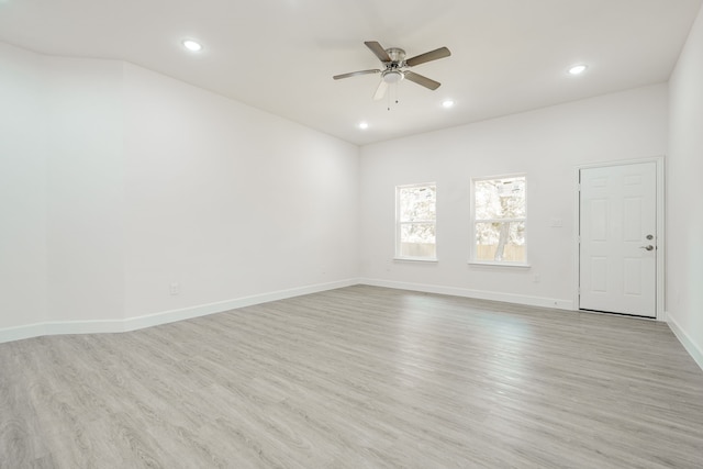 unfurnished room with ceiling fan and light hardwood / wood-style floors