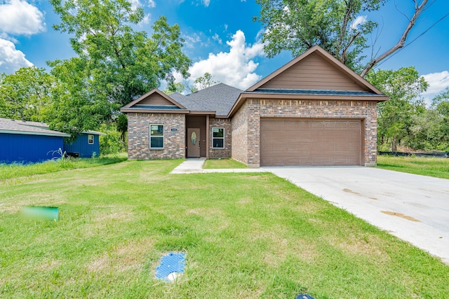 view of front of house with a garage and a front yard