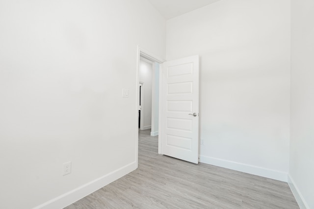 empty room with light hardwood / wood-style flooring