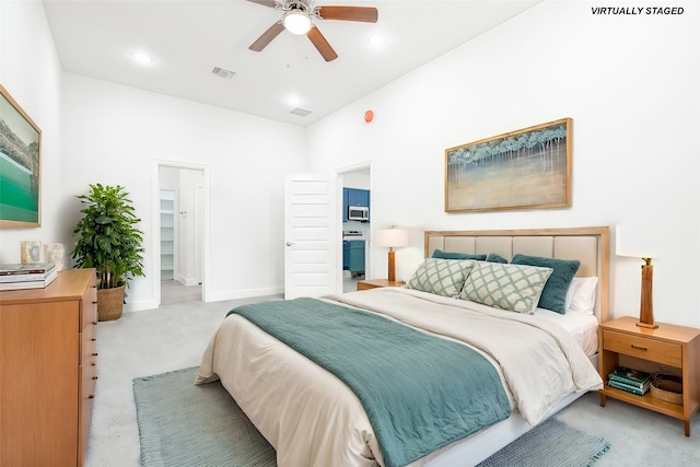 bedroom featuring a spacious closet and ceiling fan