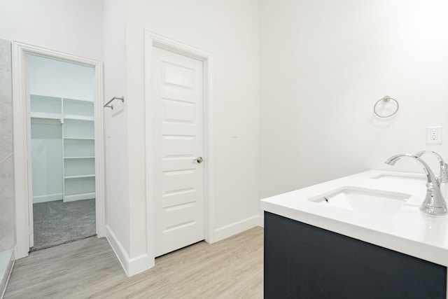 bathroom featuring vanity and hardwood / wood-style flooring