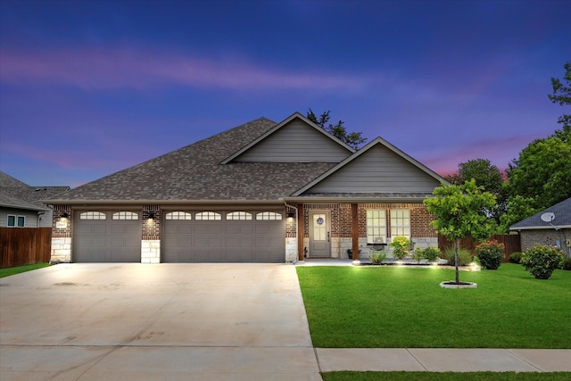 craftsman-style house with a lawn and a garage