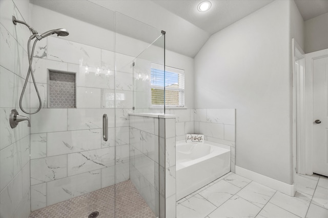 bathroom featuring plus walk in shower and lofted ceiling