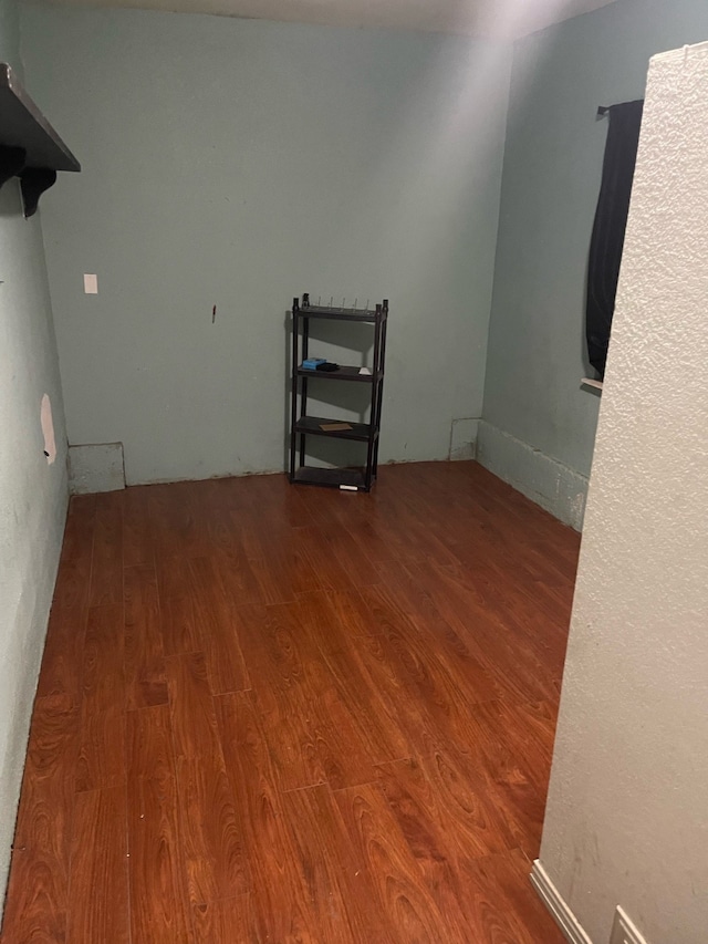 unfurnished room with hardwood / wood-style floors