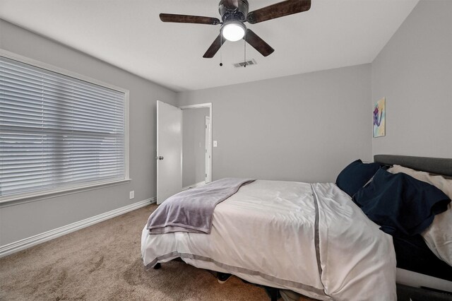 carpeted bedroom featuring ceiling fan