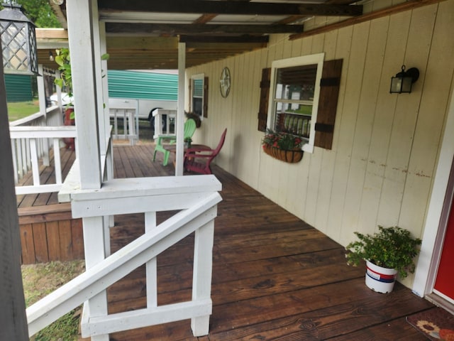 wooden terrace with a porch