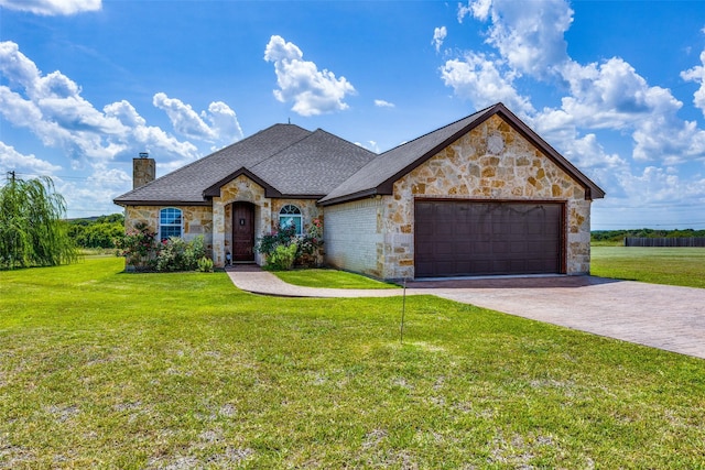 view of front of house featuring a garage and a front lawn