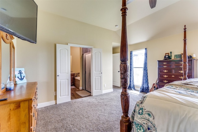 carpeted bedroom with lofted ceiling and ensuite bath