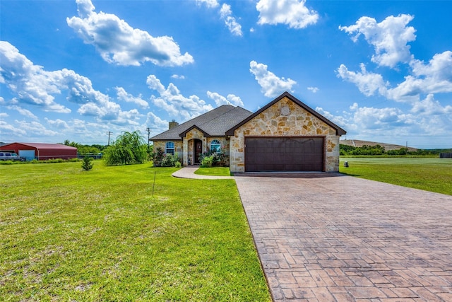 view of front facade featuring a garage and a front lawn