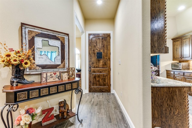 hallway featuring hardwood / wood-style floors