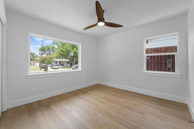 spare room featuring ceiling fan and light hardwood / wood-style flooring