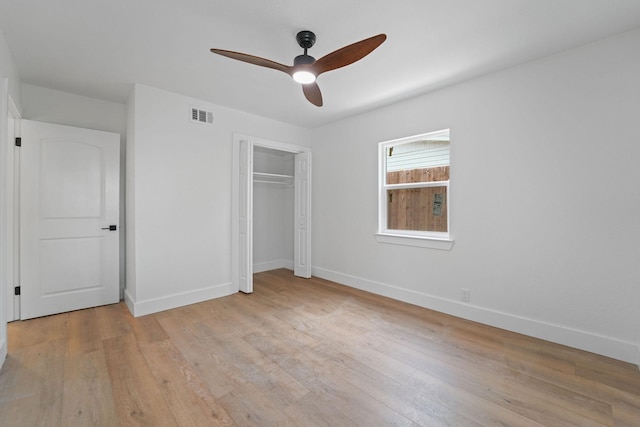 unfurnished bedroom with ceiling fan, a closet, and light hardwood / wood-style flooring