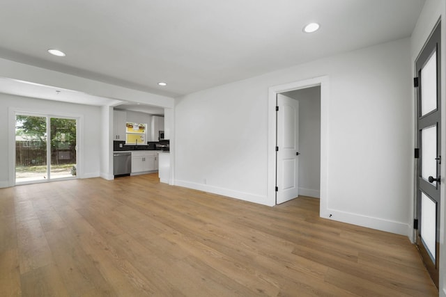 unfurnished living room with light hardwood / wood-style floors