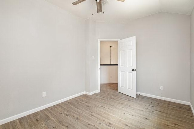 unfurnished room featuring ceiling fan, light hardwood / wood-style floors, and lofted ceiling