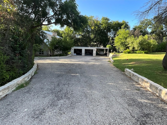 exterior space featuring a front lawn and a garage