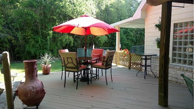 wooden deck with outdoor dining space