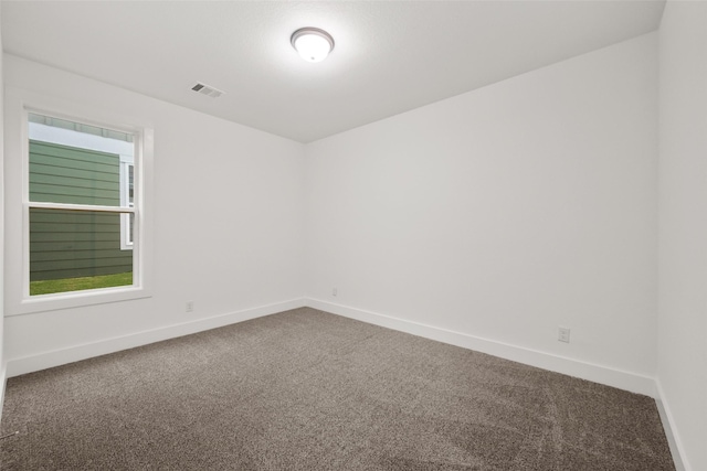 empty room featuring carpet flooring