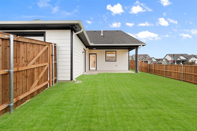 back of house featuring a lawn