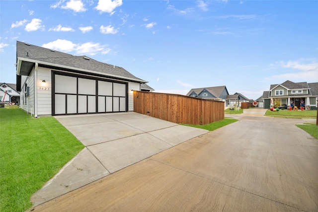 exterior space featuring a lawn and a garage