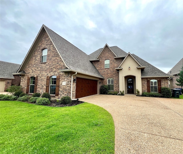 french country inspired facade with a front yard