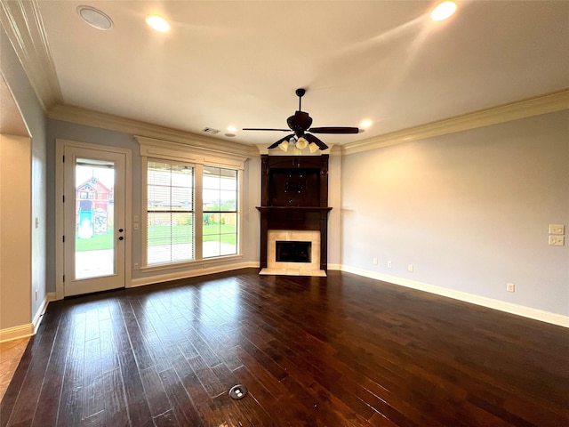 unfurnished living room featuring dark hardwood / wood-style flooring, ornamental molding, ceiling fan, and a high end fireplace