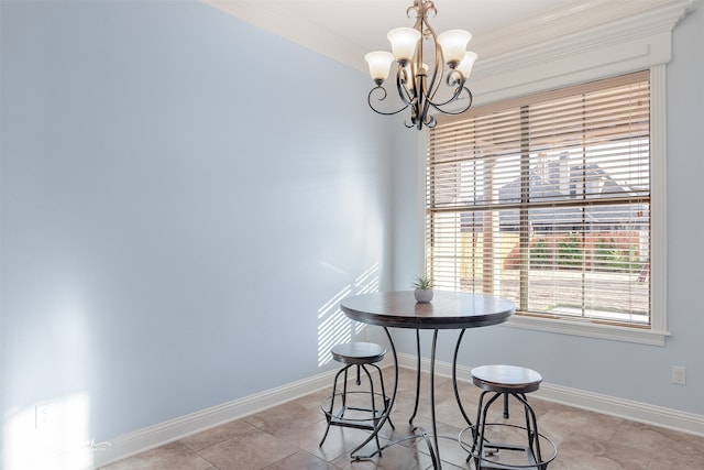 tiled dining area featuring crown molding and a chandelier