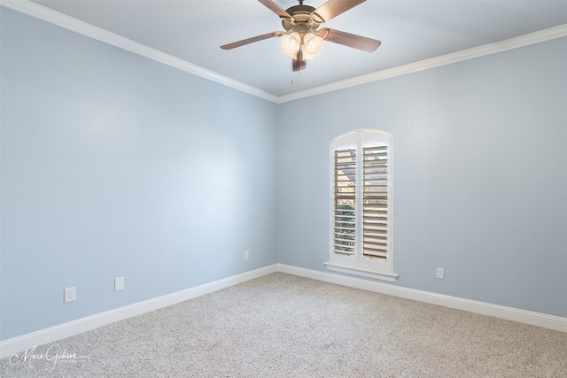 empty room with ceiling fan, ornamental molding, and carpet flooring