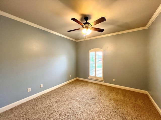 carpeted spare room with crown molding and ceiling fan