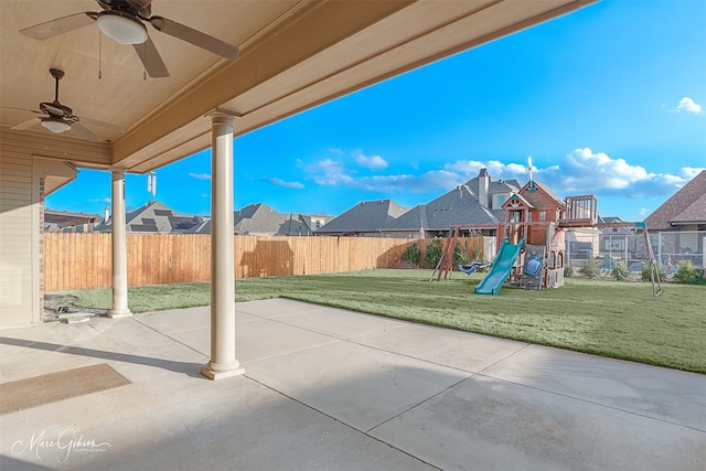 view of patio / terrace featuring a playground and ceiling fan