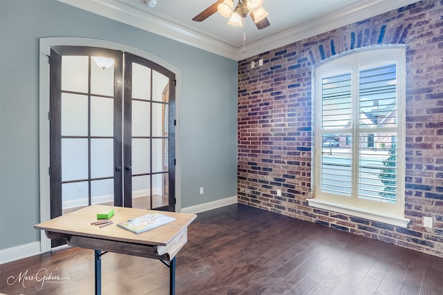 interior space with brick wall, ceiling fan, crown molding, dark wood-type flooring, and french doors