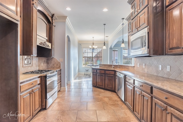 kitchen with stainless steel appliances, light stone countertops, ornamental molding, decorative light fixtures, and a chandelier