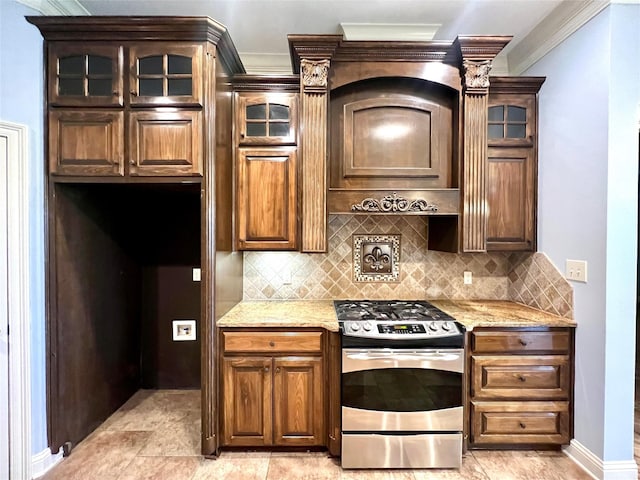 kitchen featuring tasteful backsplash, ornamental molding, stainless steel range with gas cooktop, and light stone counters