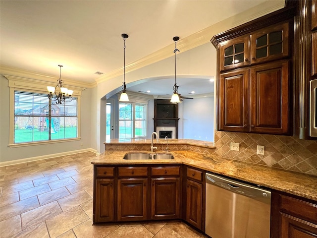 kitchen featuring dishwasher, sink, pendant lighting, and crown molding