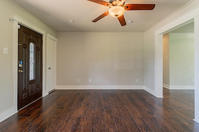 unfurnished room featuring a textured ceiling, dark hardwood / wood-style floors, ceiling fan, and ornamental molding