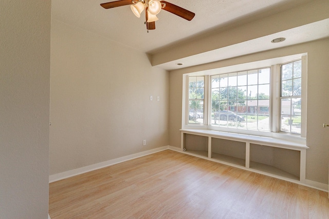 unfurnished room featuring ceiling fan and light wood-type flooring