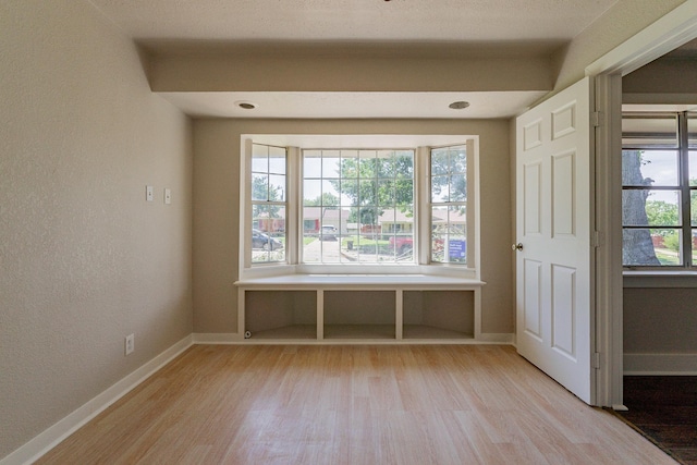 spare room featuring light hardwood / wood-style floors