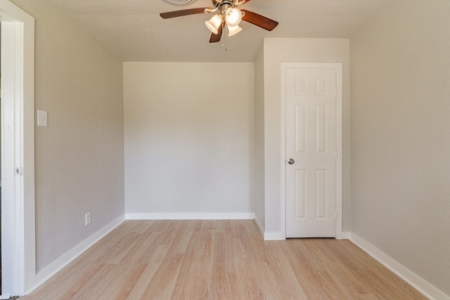 spare room featuring ceiling fan and light hardwood / wood-style flooring