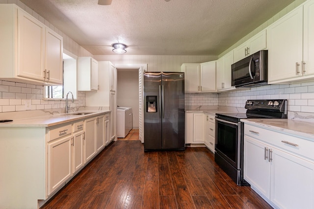 kitchen featuring stainless steel fridge with ice dispenser, white cabinets, sink, separate washer and dryer, and range with electric stovetop