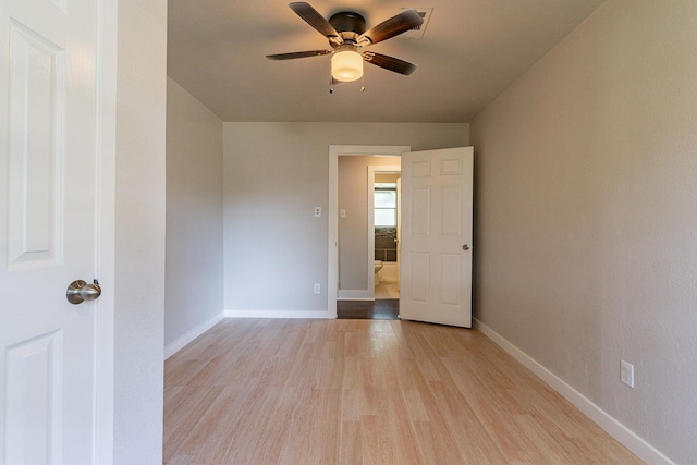 spare room with light hardwood / wood-style floors and ceiling fan