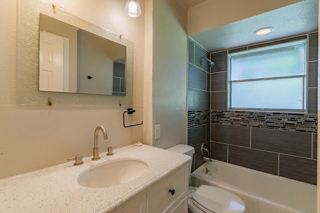 full bathroom with vanity, toilet, and tiled shower / bath combo