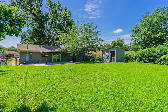 view of yard with a patio area and a shed