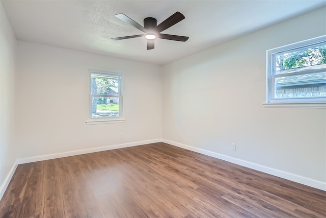 spare room with hardwood / wood-style floors, a textured ceiling, and ceiling fan